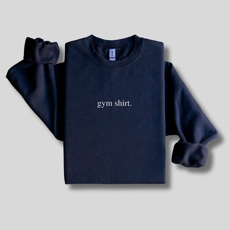 simple black gym sweatshirt featuring a minimalist text design. Made with the Gildan 18000 sweatshirt