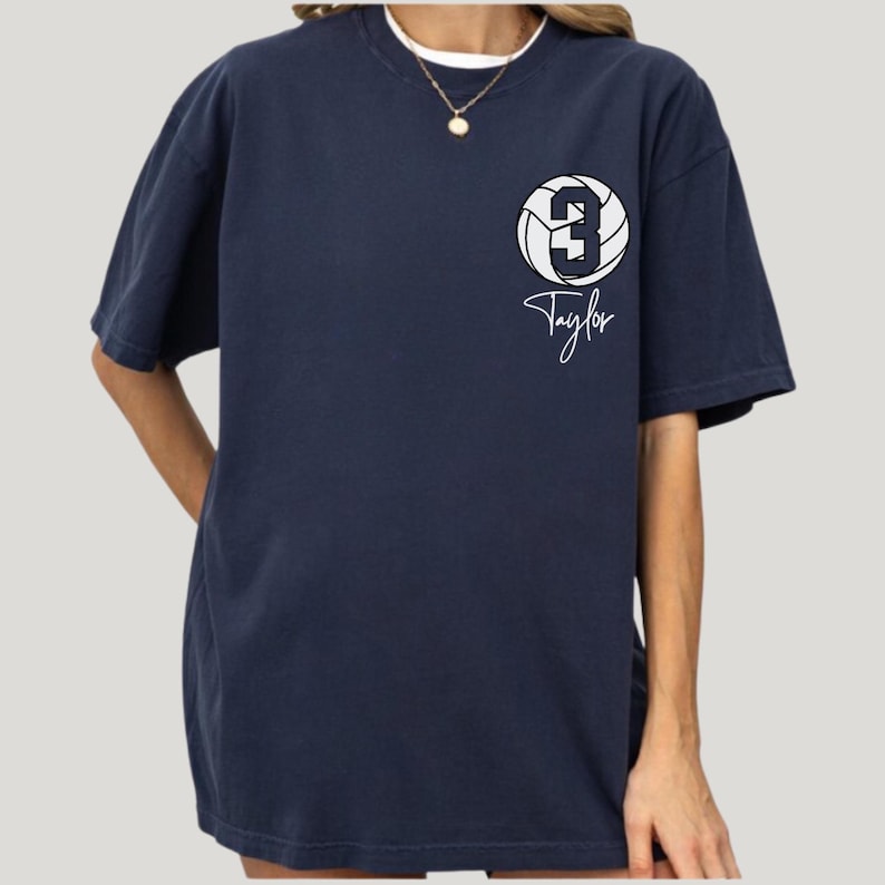 Navy Comfort Colors 1717 t-shirt with a customizable name and number volleyball graphic.