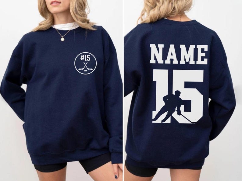 Custom hockey sweatshirt featuring a personalized hockey player name and number design on the back as well as jersey number on the front design.  Also, choose from a variety of hockey player silhouettes to further customize this hockey sweater