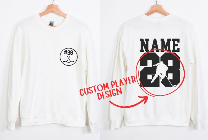 Custom hockey sweatshirt featuring a personalized hockey player name and number design on the back as well as jersey number on the front design.  Also, choose from a variety of hockey player silhouettes to further customize this hockey sweater