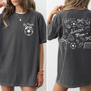 custom soccer t-shirt featuring a unique doodle graphic on the front and back. Customize the team name on the front and player number on the back to show your team pride. Crafted with the comfort colors 1717 tee