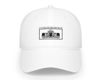May include: White baseball cap with black text that reads "It's lights out and away we go!" and a black silhouette of a race car.