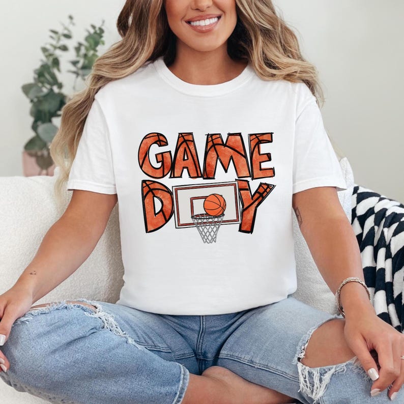 cute basketball shirt featuring a game day graphic made with basketball doodle font for a one of a kind piece