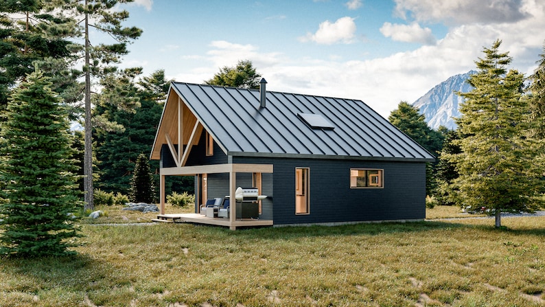 Puede incluir: Una caba&ntilde;a moderna de color azul oscuro con techo de metal y detalles en madera. La caba&ntilde;a cuenta con un porche con asientos y una parrilla, ubicada en una zona de c&eacute;sped rodeada de &aacute;rboles. Se ve una monta&ntilde;a al fondo.
