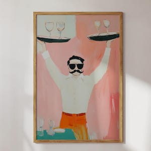 May include: A framed painting depicts a waiter with a large mustache and sunglasses, holding trays with wine glasses. The background is a blend of pink and white. The waiter wears a white shirt and orange pants.