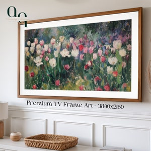May include: A framed painting of a field of white, pink, and red tulips with green leaves. The frame is a light brown wood. The text "Premium TV Frame Art - 3840x2160" is below the frame.