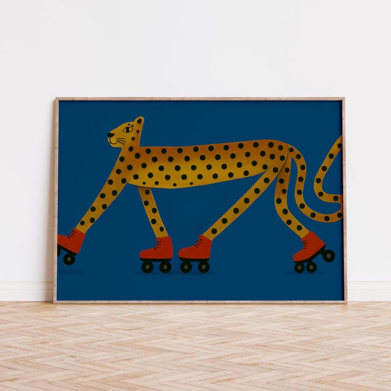 May include: A framed art print depicting a cheetah with a yellow body and black spots, wearing red roller skates. The background is a deep blue colour.