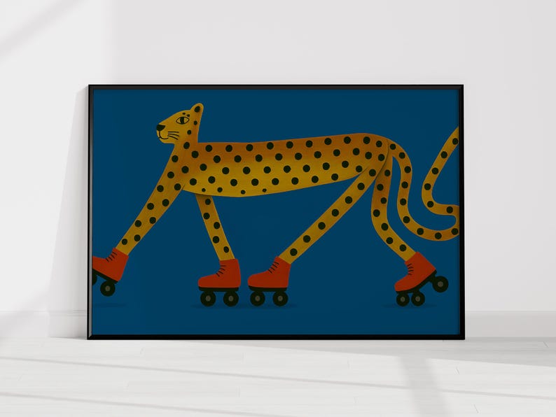 May include: A framed art print depicting a cheetah with yellow spots and orange roller skates on a dark blue background. The cheetah has a yellow body with black spots. The roller skates are orange with black wheels.