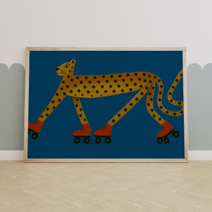May include: A framed art print depicting a cheetah with a yellow body and black spots, wearing red roller skates. The background is a deep blue. The illustration has a whimsical and playful style, suitable for a child's room.