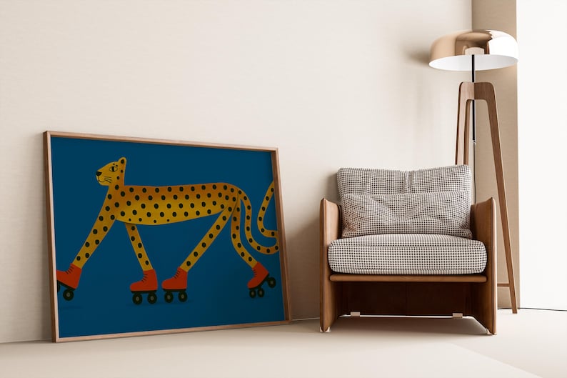 May include: A framed art print depicting a yellow cheetah with black spots, wearing red roller skates, against a deep blue backdrop. The artwork is next to a wooden armchair with a checkered pattern and a modern floor lamp.