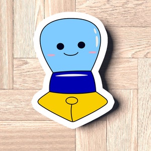 May include: A blue and yellow cartoon character with a smiling face. The character has a blue head with a yellow body and a blue and yellow hat.