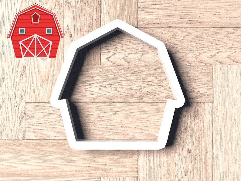 May include: White plastic cookie cutter shaped like a barn with a simple design.