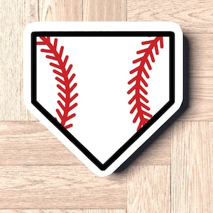May include: White baseball home plate sticker with a red baseball stitch design.