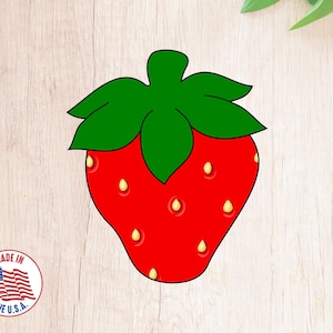 May include: A red strawberry with green leaves and yellow seeds. The strawberry is drawn in a cartoon style.