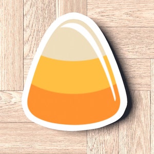 Könnte beinhalten: Eine Illustration von gelbem, orangefarbenem und weißem Maisbonbon.