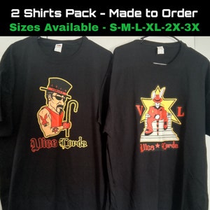 May include: Two black t-shirts featuring a cartoon character graphic print. The character on the left is wearing a red shirt, a hat, and holding a cane. The character on the right is wearing a red suit and a hat with bunny ears. Both shirts have the text "Vice Lords" printed on them.