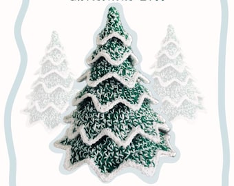 May include: A plush, crocheted Christmas tree in shades of green and white, with a textured appearance. The tree has a layered design and is surrounded by two blurred, lighter versions of itself. The words "Christmas Tree" and "Plush Crochet Pattern & Tutorial" are also visible.
