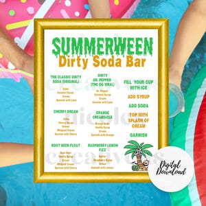 May include: A rectangular gold-framed sign titled Summerween Dirty Soda Bar with green and orange text listing drink recipes including The Classic Dirty Soda, Dr. Pepper, Cherry Dream, Orange Creamsicle, Root Beer Float, and Raspberry Lemon Fizz.
