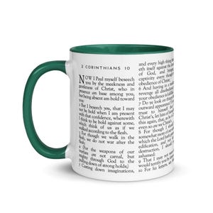 May include: White ceramic mug with a green interior and handle. The mug features printed text from 2 Corinthians 10. A perfect gift for anyone who loves scripture and coffee or tea.