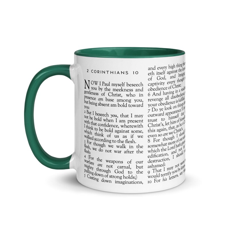 May include: White ceramic mug with a green interior and handle. The mug features printed text from 2 Corinthians 10. A perfect gift for anyone who loves scripture and coffee or tea.