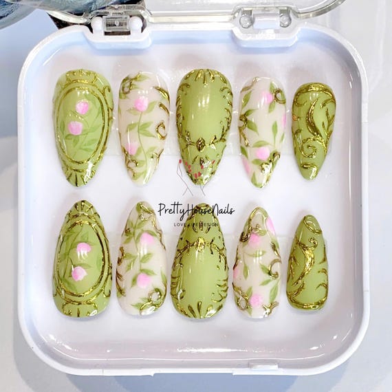 Hand-painted Mint Green Almond Press On Nails with Floral Patterns, Gold Sculpted Accents, Trendy Nail Art for a Stylish Look, Unique Nails.