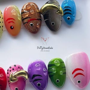 fish nail art, ocean theme nails, colorful press on, cute fake nails, kawaii nail set, summer nail design, handmade press on, festival nail art, fun nail designs, aquatic nail set, quirky fake nails, rainbow press on, unique nail art, holiday nails, party nails, short oval nails