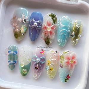 Unghie a pressione primaverili con fiori 3D, perle e fiocchi pastello, set di unghie floreali fatte a mano, unghie da festa del tè, unghie pasquali, eleganti unghie a mandorla