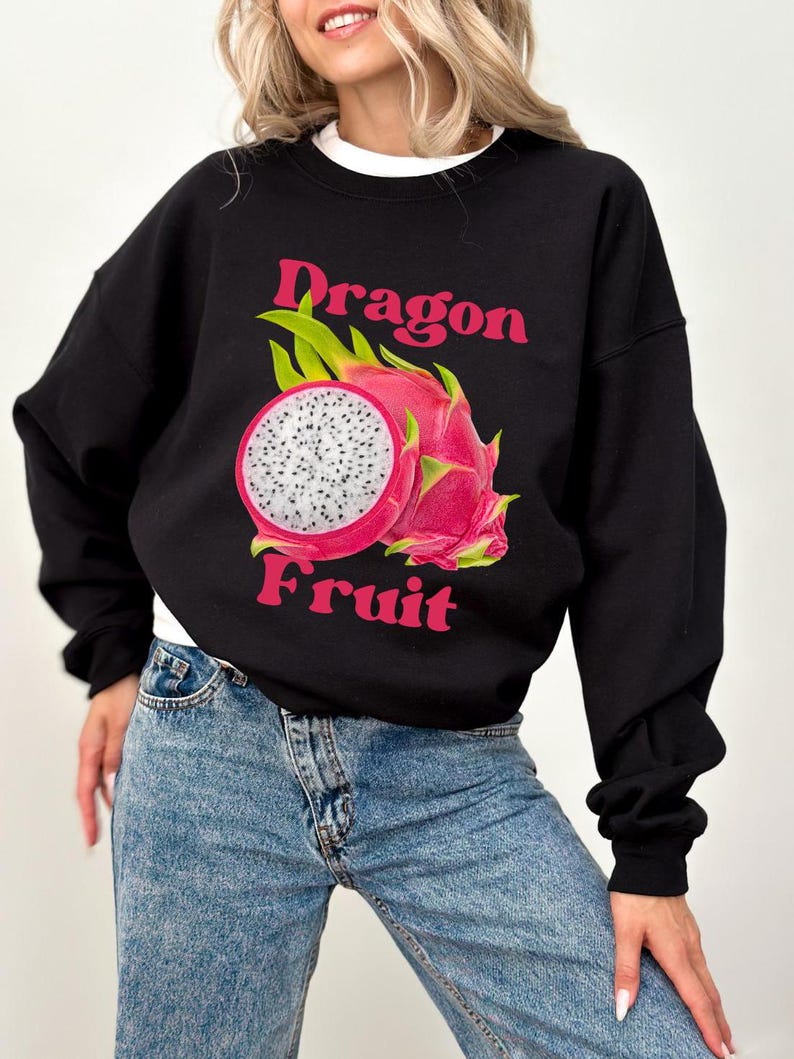 May include: Black sweatshirt with a pink and white dragon fruit graphic and the text "Dragon Fruit" in pink.