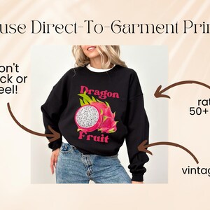 May include: Black sweatshirt with a graphic print of a dragon fruit and the text "Dragon Fruit".