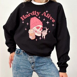 Hardly Alive Funny Halloween Unisex Crewneck Sweartshirt Pink Skeleton Halloween Coffee Shirt Y2K Halloween Coffee Skeleton Sweatshirt
