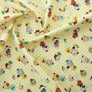 May include: Yellow fabric with a white checkered pattern featuring a repeating design of girls in dresses, houses, and watering cans.