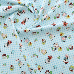 May include: Blue and white gingham fabric with a repeating pattern of girls in dresses and hats. The girls are carrying baskets, watering cans, and other gardening tools. There are also small houses and flowers in the pattern.