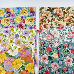May include: A collection of six rectangular sheets of paper featuring various floral patterns. The designs include vibrant yellow, pink, and purple roses, soft pastel watercolor flowers, and detailed botanical prints on cream and teal backgrounds.