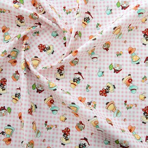 May include: Pink and white gingham fabric with a repeating pattern of black and white figures wearing red hats and carrying baskets. The figures are surrounded by small white flowers and green leaves.