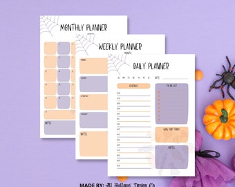 Op de afbeelding: Drie afdrukbare Halloween-plannerpagina's met een spinnenwebontwerp. De pagina's zijn gelabeld met "Maandplanner", "Weekplanner" en "Dagplanner".