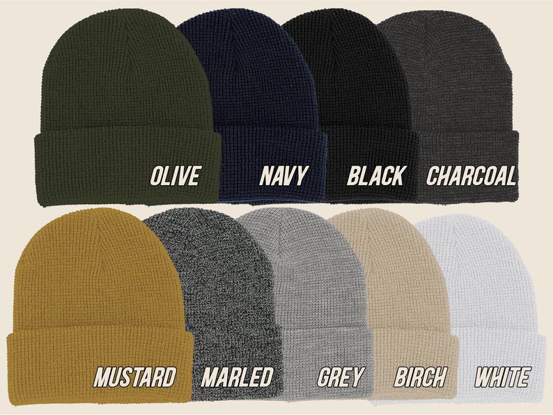 May include: A collection of ten beanies in various colors, including olive, navy, black, charcoal, mustard, marled, grey, birch, and white. Each beanie has a folded brim and the color name printed in white.