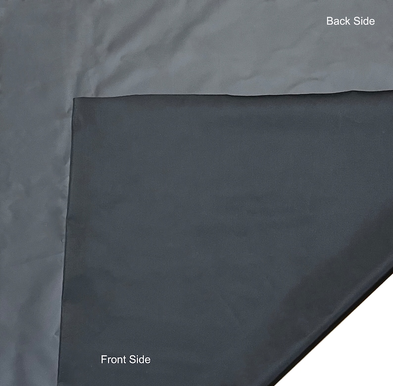 May include: A folded, two-toned fabric with a dark gray front side and a lighter gray back side. The image shows the contrast between the two sides, with the text "Front Side" and "Back Side" labeling each.