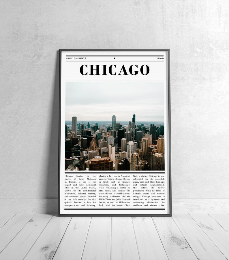 May include: A framed print featuring a photograph of the Chicago skyline. The word "CHICAGO" is printed in bold, black letters at the top. The image shows a cityscape with numerous skyscrapers under a cloudy sky. The print is displayed against a white wall.