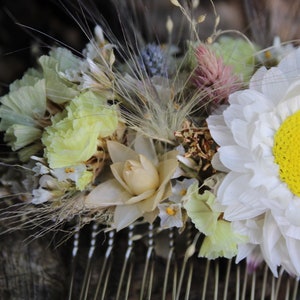The flowers include a light lemon yellow statice, silvery cream straw flower heads,  perennial statice, pastel pink statice, blue thistle heads, pink flamingo celosia, bunny tail grass, eucalyptus leave and a single ...