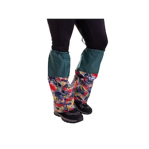 May include: A pair of green and multi-colored waterproof gaiters with a drawstring closure. The gaiters are worn over black pants and black boots.