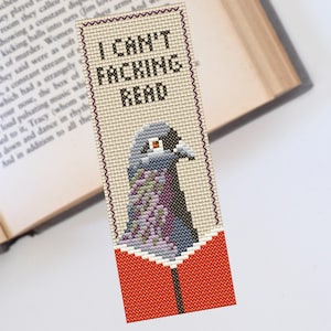 May include: A beige and orange cross-stitch bookmark with a gray pigeon and the text "I CAN'T FACKING READ".