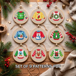 Christmas ornament cross stitch set of 9 sweater designs in wooden hoops on linen with holiday flatlay, PDF, TourmalinePattern on Etsy.