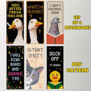 May include: A set of six cross-stitch bookmarks featuring animal designs and humorous text. The bookmarks include a goose, a pigeon, and a cat, with phrases like "Whatcha Reading?" and "I Will Read Books and Ignore You".