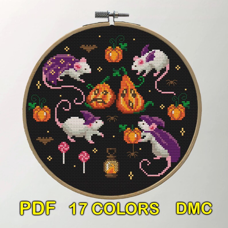 A cross-stitch design featuring white mice with purple capes interacting with pumpkins and other Halloween elements. The background is black, emphasizing the bright colors of the mice and pumpkins.