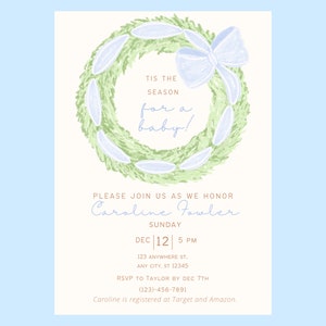 May include: A baby shower invitation with a green and white wreath with a blue bow. The text reads "Tis the season for a baby!" and includes the name "Caroline Fowler", the date "Dec 12", the time "5 PM", and the address "123 Anywhere St, Any City, ST 12345".