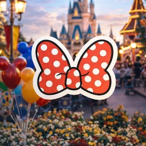 May include: A large, red bow with white polka dots, outlined in black, is the focal point. The background features a blurred theme park scene with a castle, balloons, and flowers, creating a festive atmosphere.