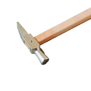 May include: A silver hammer with a wooden handle. The hammer has a flat head and a curved claw.