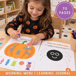 May include: A learning journal with 70 pages featuring educational activity sheets. One sheet shows a large orange pumpkin with candy shapes and the text 'Place candies on the correct', while another sheet shows a spider with the text 'Draw the spider legs'.