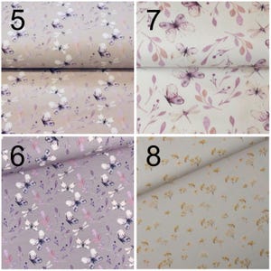 May include: Four fabric swatches with different patterns. The top left swatch has a light brown background with a purple butterfly pattern. The top right swatch has a light beige background with a purple butterfly pattern. The bottom left swatch has a light gray background with a purple butterfly pattern. The bottom right swatch has a light gray background with a yellow flower pattern.