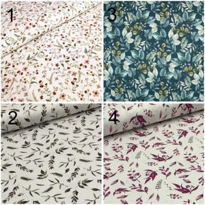 May include: Four fabric swatches with different floral patterns. The first swatch has a white background with small pink and red flowers. The second swatch has a white background with small brown leaves. The third swatch has a teal background with green leaves. The fourth swatch has a white background with small purple leaves.